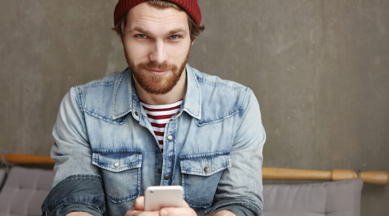 Portrait Attractive Young Student With Thick Beard Wearing Hat Denim Jacket