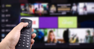 hand-holding-tv-remote-control-with-smart-tv
