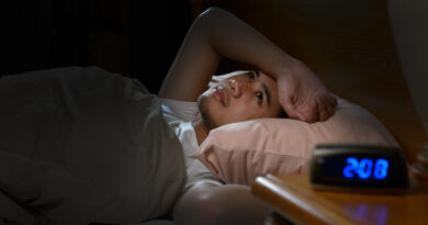 depressed-man-suffering-from-insomnia-lying-bed