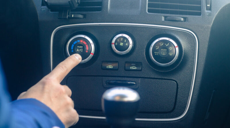 Young Man Is Turning Car Air Conditioning System