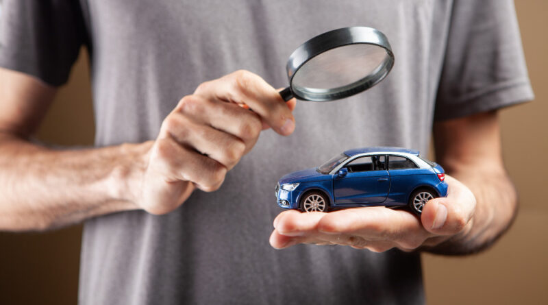 Man Looks Car With Magnifying Glass Car Search Concept