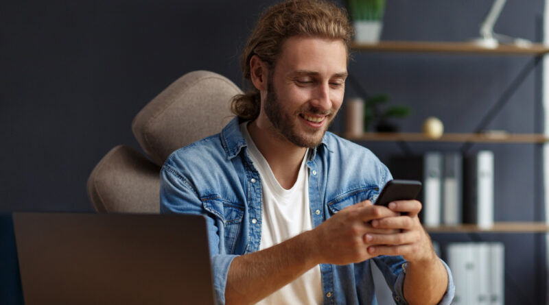 Young Man Using Smartphone Smiling Happy Businessman Using Mobile Phone Apps Texting Message Browsing Internet Looking Smartphone Concept Young People Working With Mobile Devices