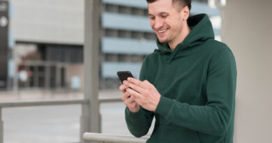 Portrait Smiley Man With Mobile