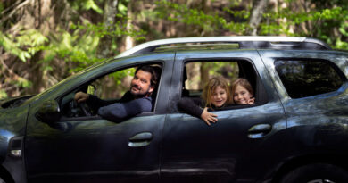 side-view-family-traveling-by-car