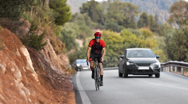 Male Cyclist Training With Bicycle Outdoors