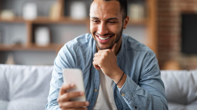 Handsome Young Black Man Looking Smartphone His Hand Smiling