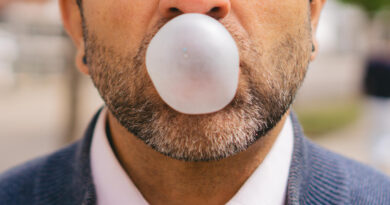 closeup-detail-bubble-made-chewing-gum-by-middleaged-latin-man-with-slightly-graying-beard