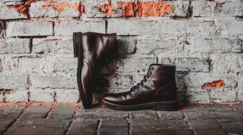 closeup-pair-classic-shoes-brick-wall