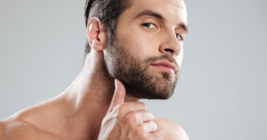 Portrait Handsome Naked Bearded Man Examining His Face