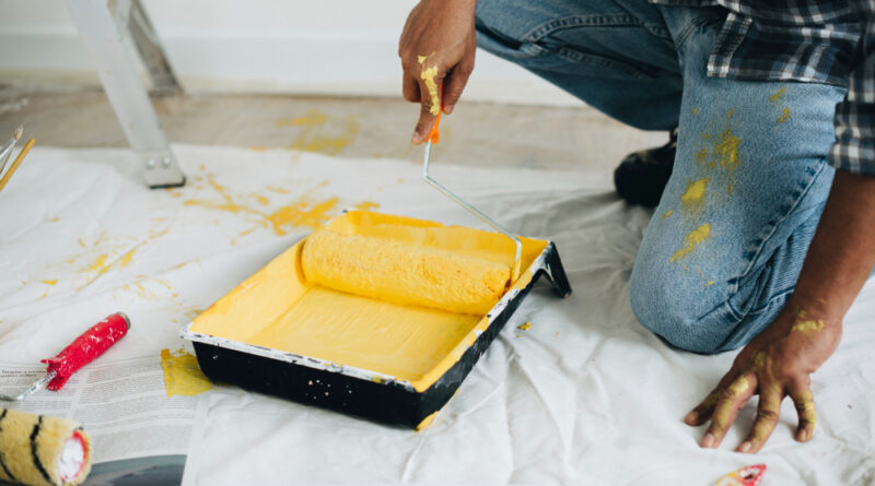 Man Painting Walls Yellow