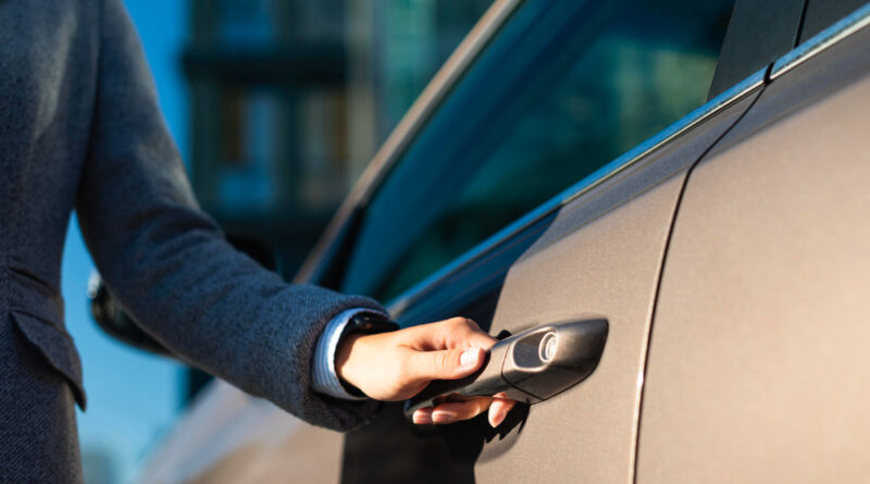 Businesswoman Opening Her Car Door