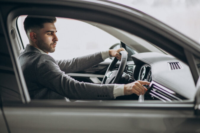 handsome-business-man-driving-car