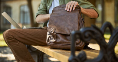Cropped Photo Man Casual Clothes Searching Something His Leather Bag
