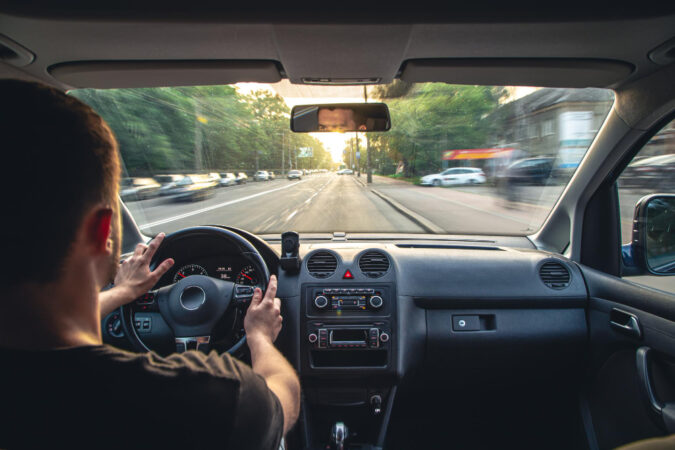 hands-wheel-when-driving-high-speed-from-inside-car