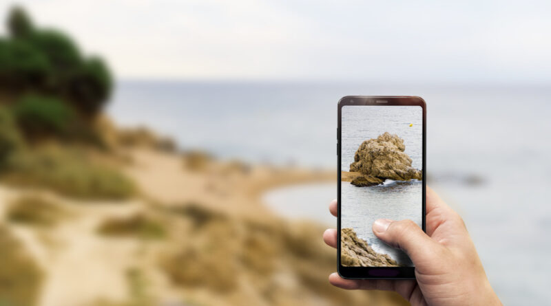 Closeup Hand Holding Phone Taking Photo Beach