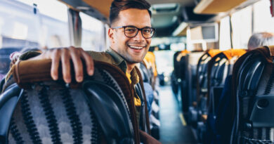 Happy Young Handsome Man Traveling By Bus