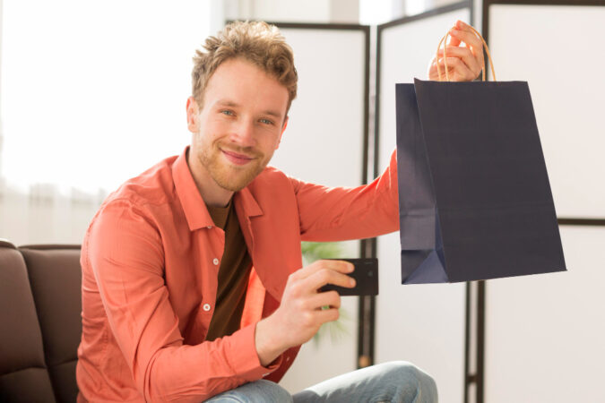 Man Holding Bag Credit Card