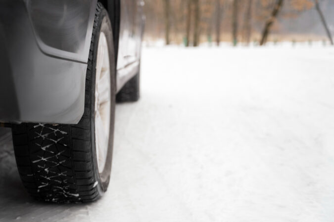 Close Up Car Tire During Winter Roadtrip