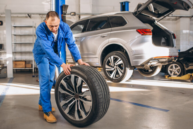 Auto Mechanic Checking Car