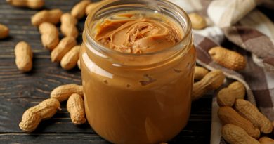 peanut-napkin-jar-with-peanut-butter-wooden-background