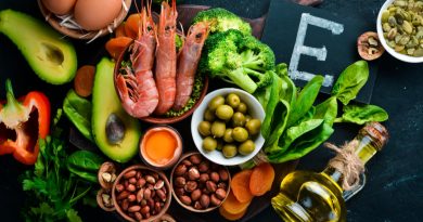 food-containing-natural-vitamin-e-spinach-parsley-shrimp-pumpkin-seeds-eggs-avocados-broccoli-top-view-black-background