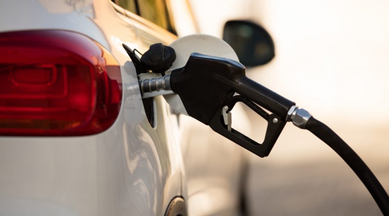 White Car Gas Station Being Filled With Fuel