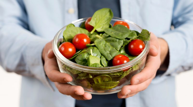 Close Up Man S Hand Holding Bowl Salad