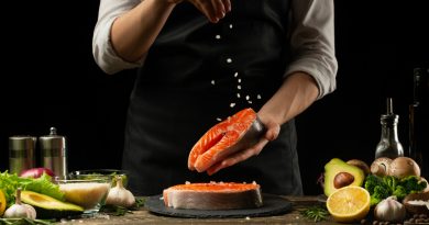 chef-prepares-fresh-salmon-fish-smorgu-trout-sprinkling-salt-with-ingredients