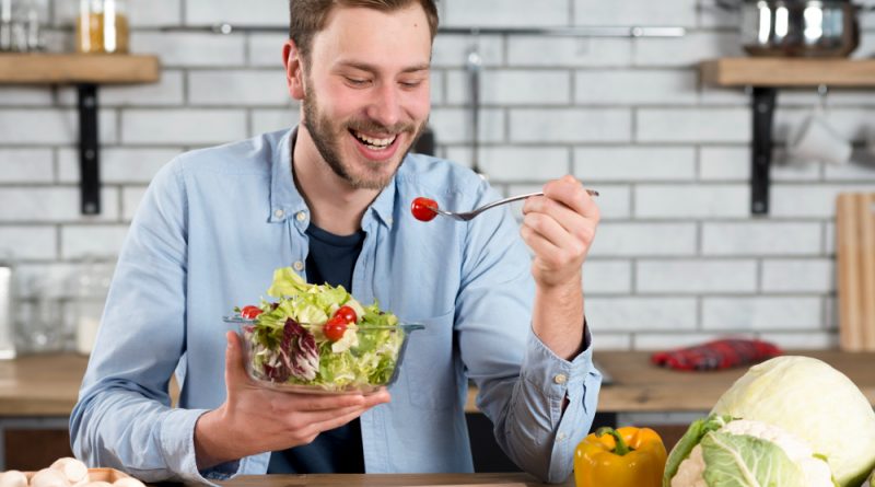 Portrait Happy Man Eating Fresh Salad Kitchen