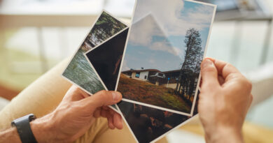 Close Up Man Holding Photos With Beautiful Landscapes His Hands