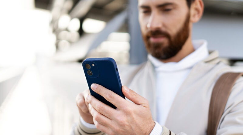 Close Up Man Holding Smartphone (1)