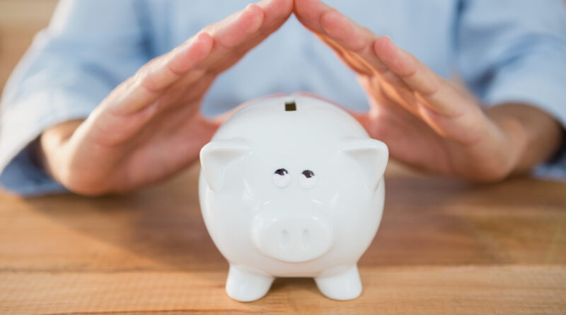 Man Making Roof Gesture Piggy Bank