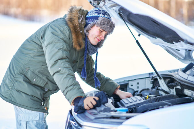 Man Having Problem With Car During Snowy Winter High Quality Photo