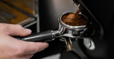close-up-male-barista-using-professional-coffee-machine