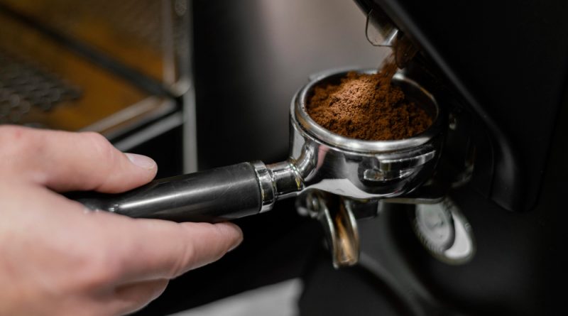 Close Up Male Barista Using Professional Coffee Machine