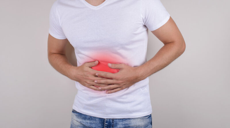 Cropped Close Up Studio Photo Portrait Upset Sad Scared Worried Troubled Gut Having Stomach Ache Disorder Wear Denim Pants Isolated Grey Background