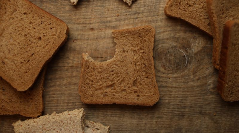 Sliced bread wooden background