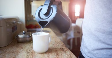 hand-white-man-pouring-hot-boiling-water-from-electric-kettle-mug-with-tea-bag