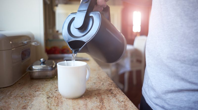 Hand White Man Pouring Hot Boiling Water From Electric Kettle Mug With Tea Bag