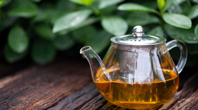 Hot Tea With Glass Teapot Wooden Green Leaf