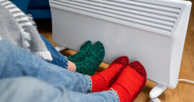 close-up-people-with-legs-near-heater