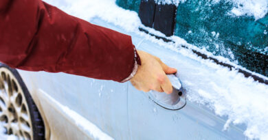 Male Hand Unlocking Frozen Car Lock