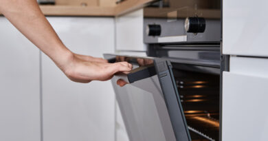 woman-hand-open-electric-oven-door-with-handle-homemade-cooking-kitchen-appliance