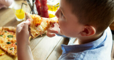 Close Up Boy With Pizza Slice