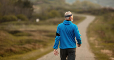 Back View Senior Athlete Walking Road Nature While Keeping Up His Healthy Lifestyle Copy Space