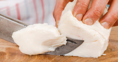 cook-cuts-raw-pork-fat-into-small-pieces-wooden-cutting-board