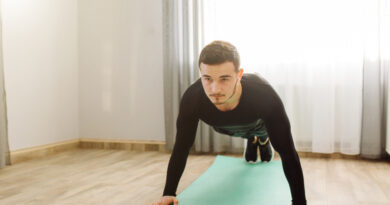 young-man-making-sport-exercises-home