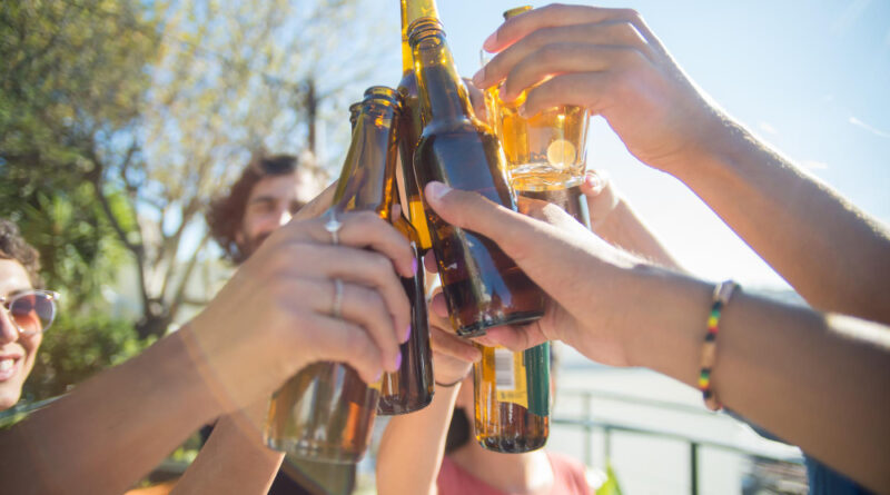 Close Up Content Friends Clinking Beer Bottles Glasses People Different Nationalities Raising Bottles Laughing Celebrating Birthday Party Friendship Concept