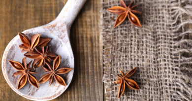 star-anise-wooden-spoon-wooden-background