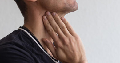 Man Touching His Neck Having Throat Irritation Grey Background